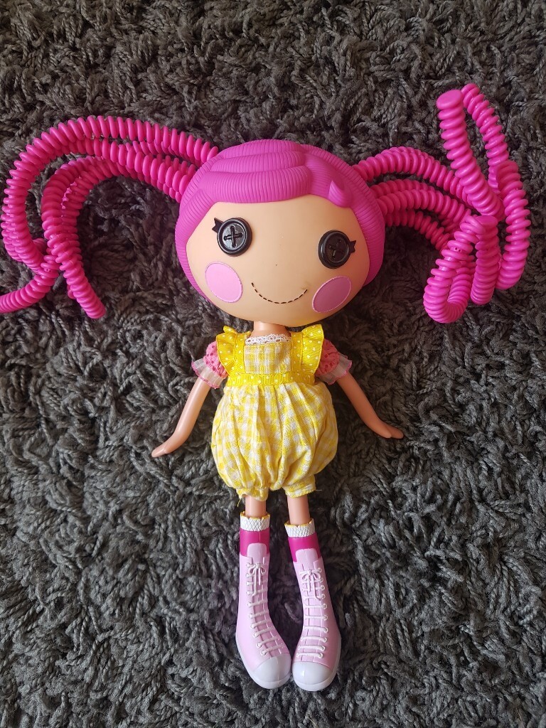 doll with pink hair and button eyes
